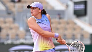 Swiatek secures spot in third round with thorough defeat of Raducanu